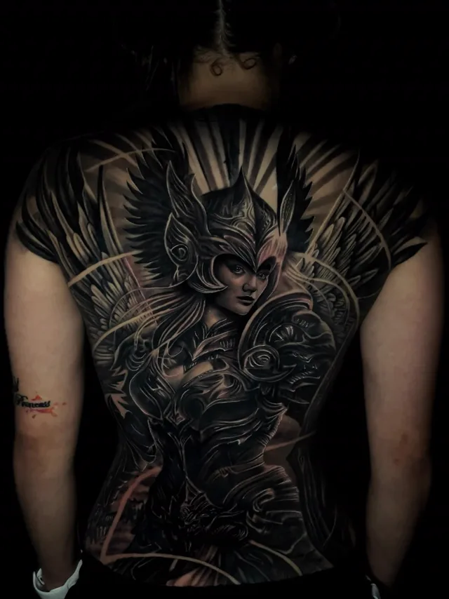 Full back black and grey realism tattoo of a winged armored Valkyrie warrior